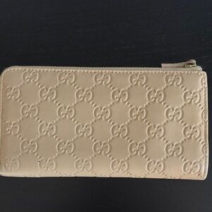 Gucci Guccissima Embossed GG Zip Around Wallet in Nude Beige